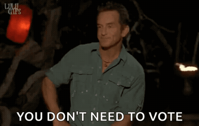 Man In Green Shirt Standing In Front Of Sign Saying You Don't Need To Vote GIF
