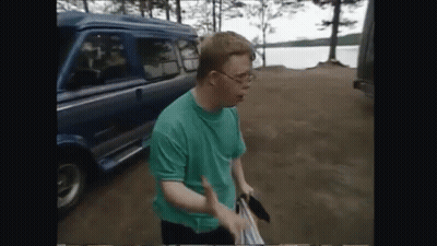 Man In Green Shirt Standing In Front Of Van GIF