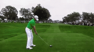 Man In Green Shirt Swinging Golf Club GIF