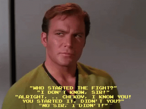 Man In Green Shirt Talking To Man In Yellow Shirt GIF