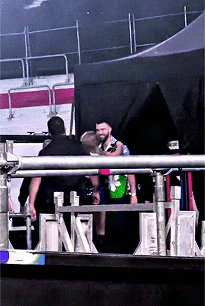 Man In Green Shirt With Flower GIF