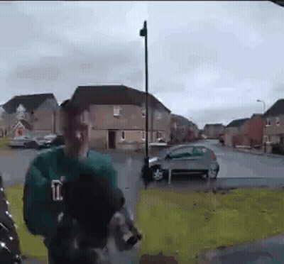 Man In Green Shirt With Letter L GIF