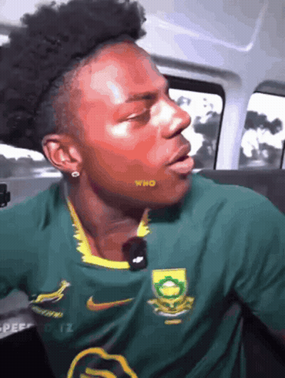 Man In Green Shirt With Who On Cheek GIF