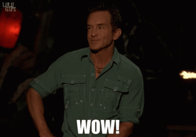 Man In Green Shirt With Wow On Chest GIF
