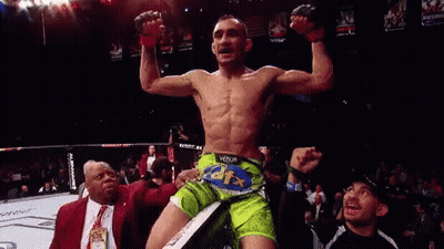 Man In Green Shorts In Boxing Ring GIF