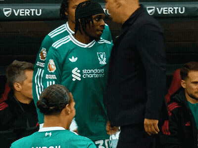 Man In Green Standard Chartered Shirt Talking To Another Man GIF