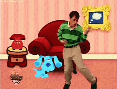 Man In Green Striped Shirt Dancing With Blue Dog In Front Of Red Chair GIF