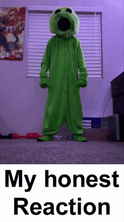 Man In Green Suit And Glasses Standing In Front Of Wooden Door GIF