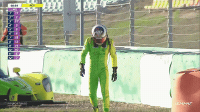 Man In Green Suit And Helmet With Yellow Car Number 7 GIF
