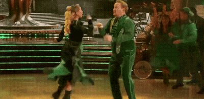 Man In Green Suit Dancing With Woman In Black Dress GIF