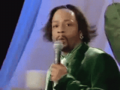 Man In Green Suit Holding Microphone GIF