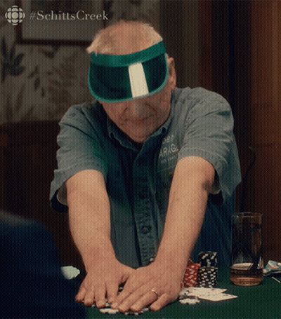 Man In Green Sun Visor Playing Poker GIF