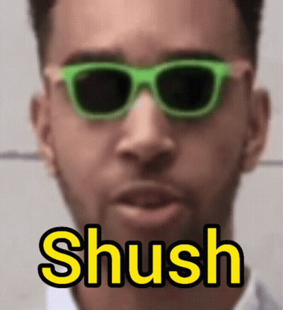 Man In Green Sunglasses Saying Shush In Yellow GIF