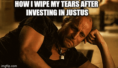 Man In Green Superhero Costume Kneeling On Bridge GIF