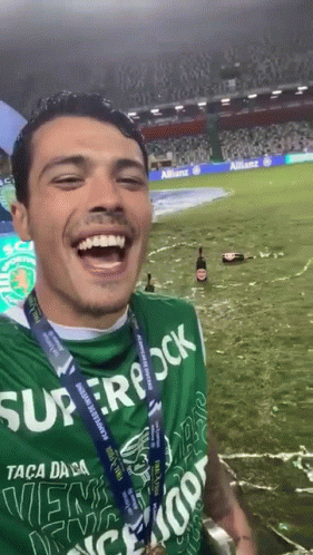 Man In Green Superrock Shirt Smiling GIF