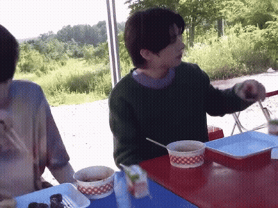 Man In Green Sweater Eating Soup GIF