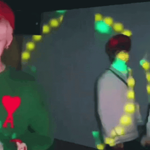 Man In Green Sweater Holding Lit Candle GIF