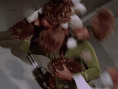 Man In Green Sweater Holding Stuffed Animal GIF