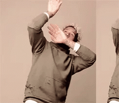 Man In Green Sweater Making Stop Sign GIF
