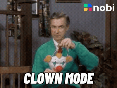 Man In Green Sweater With Stuffed Clown Clown Mode GIF