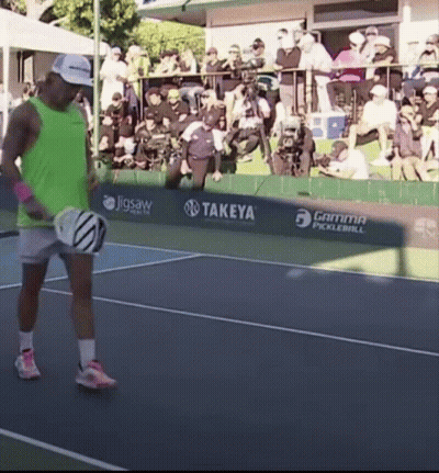 Man In Green Tank Top Holding Tennis Racket GIF