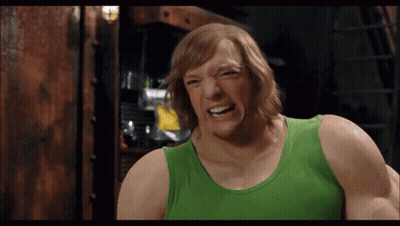 Man In Green Tank Top Making A Face GIF