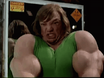 Man In Green Tank Top With Muscles In Front Of Danger Sign GIF
