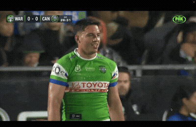 Man In Green Toyota Jersey In Front Of Crowd GIF