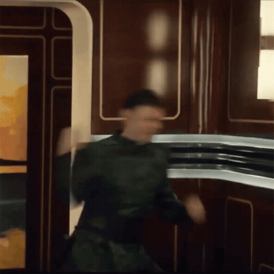 Man In Green Uniform Dancing GIF