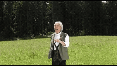 Man In Green Vest In Field GIF