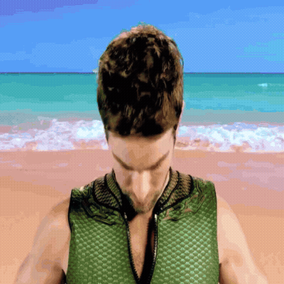 Man In Green Vest On Beach GIF