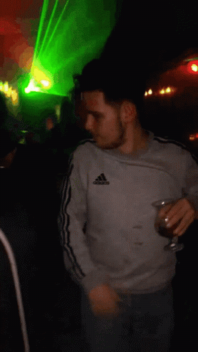 Man In Grey Adidas Sweatshirt Holding Glass GIF