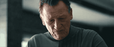 Man In Grey Adidas Sweatshirt Holding Glass GIF