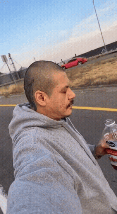 Man In Grey Hoodie Holding Soda GIF