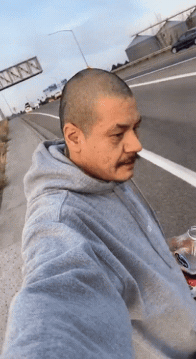 Man In Grey Hoodie Holding Soda GIF