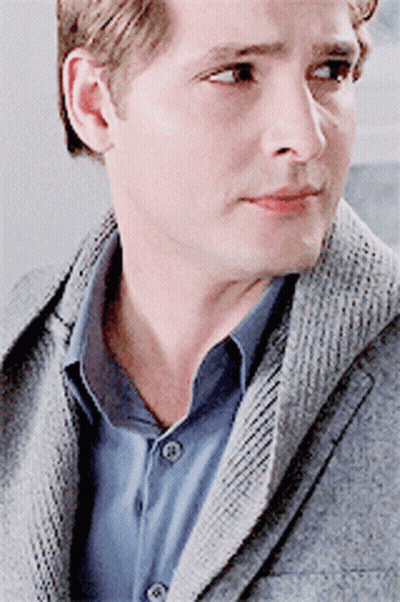 Man In Grey Jacket And Blue Shirt Close Up GIF