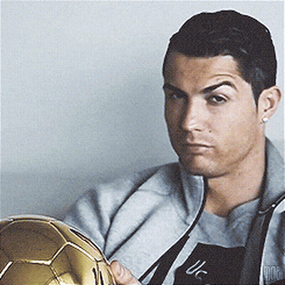Man In Grey Jacket Holding Golden Soccer Ball GIF