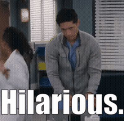 Man In Grey Jacket Next To Woman Saying Hilarious GIF