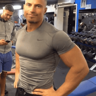 Man In Grey Nike Shirt Standing In Gym GIF