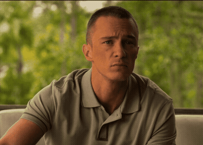 Man In Grey Polo Shirt Sitting On Couch GIF