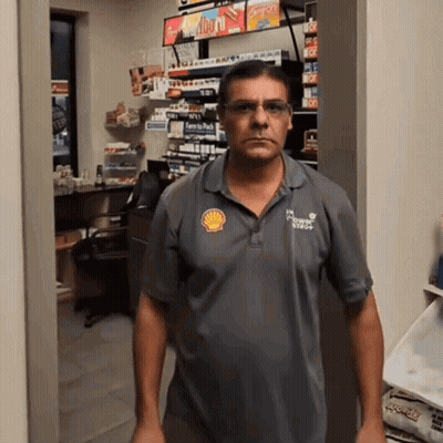 Man In Grey Shell Logo Shirt GIF