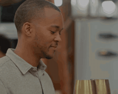 Man In Grey Shirt Holding Wine GIF