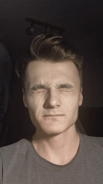 Man In Grey Shirt Making Funny Face GIF