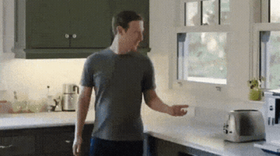 Man In Grey Shirt Next To Toaster And Window GIF