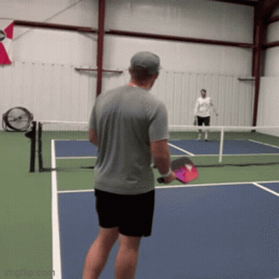 Man In Grey Shirt Playing Tennis On Blue Court GIF