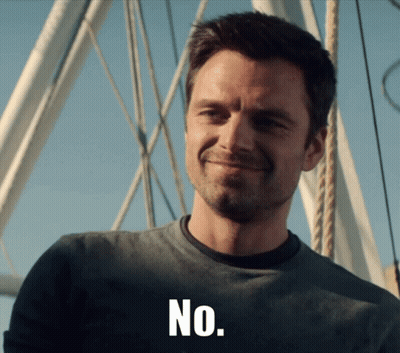 Man In Grey Shirt Smiling Saying No GIF