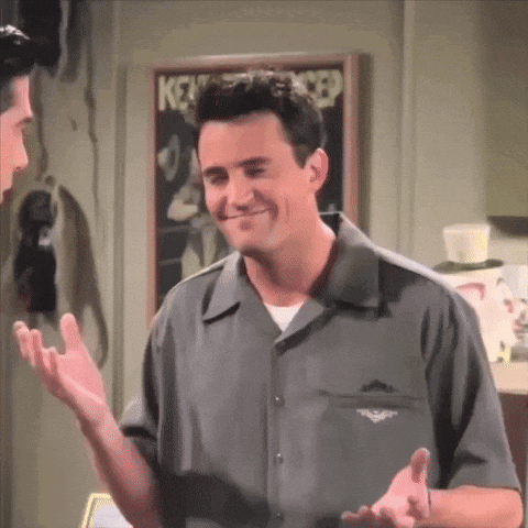 Man In Grey Shirt Talking To Man In Front Of Keystone Cop Poster GIF