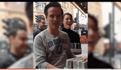 Man In Grey Shirt With Irsland GIF