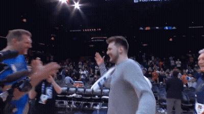 Man In Grey Shirt With Locked In Sign In Crowd GIF