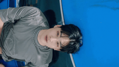 Man In Grey Shirt With Silver Chain GIF
